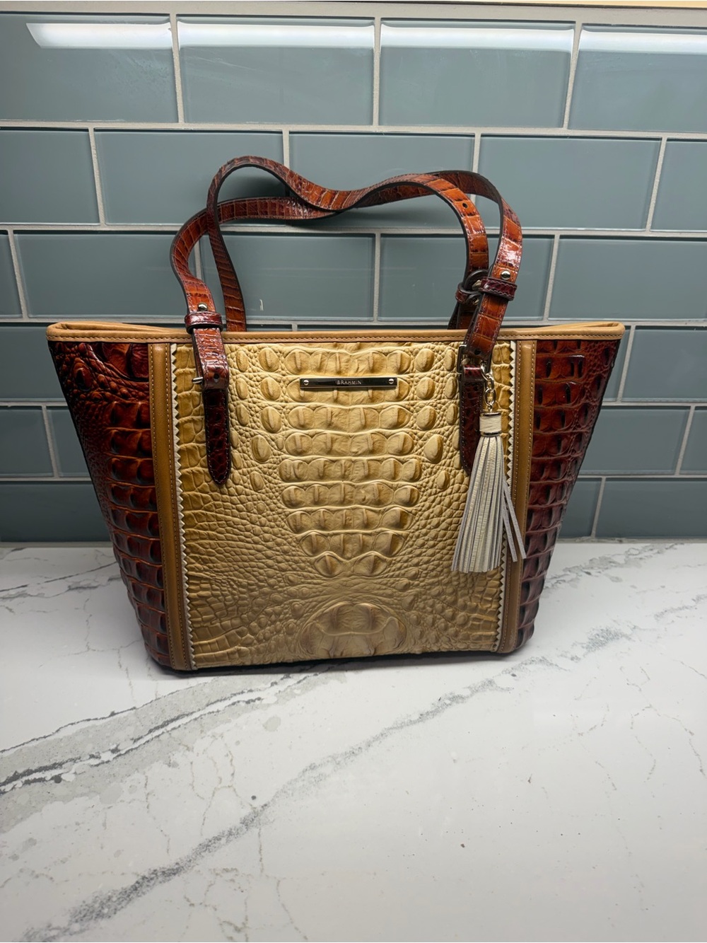 Brahmin Two-Tone Croc-Embossed Tote in Gold and Brown with Cream Tassel